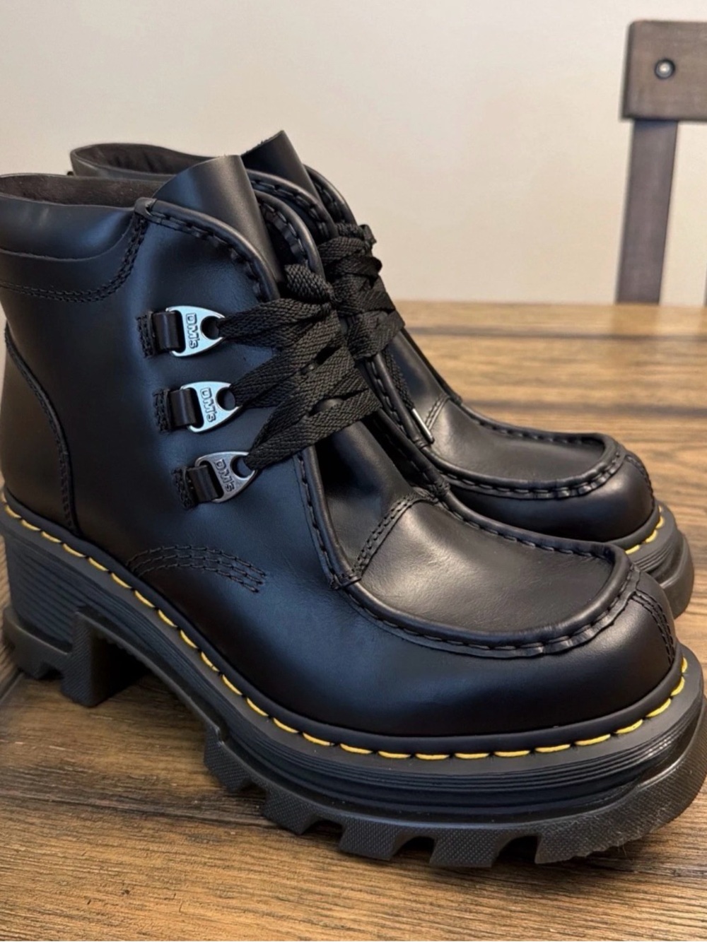 Dr. Martens Black Leather Lug-Sole Ankle Boots with Yellow Stitching